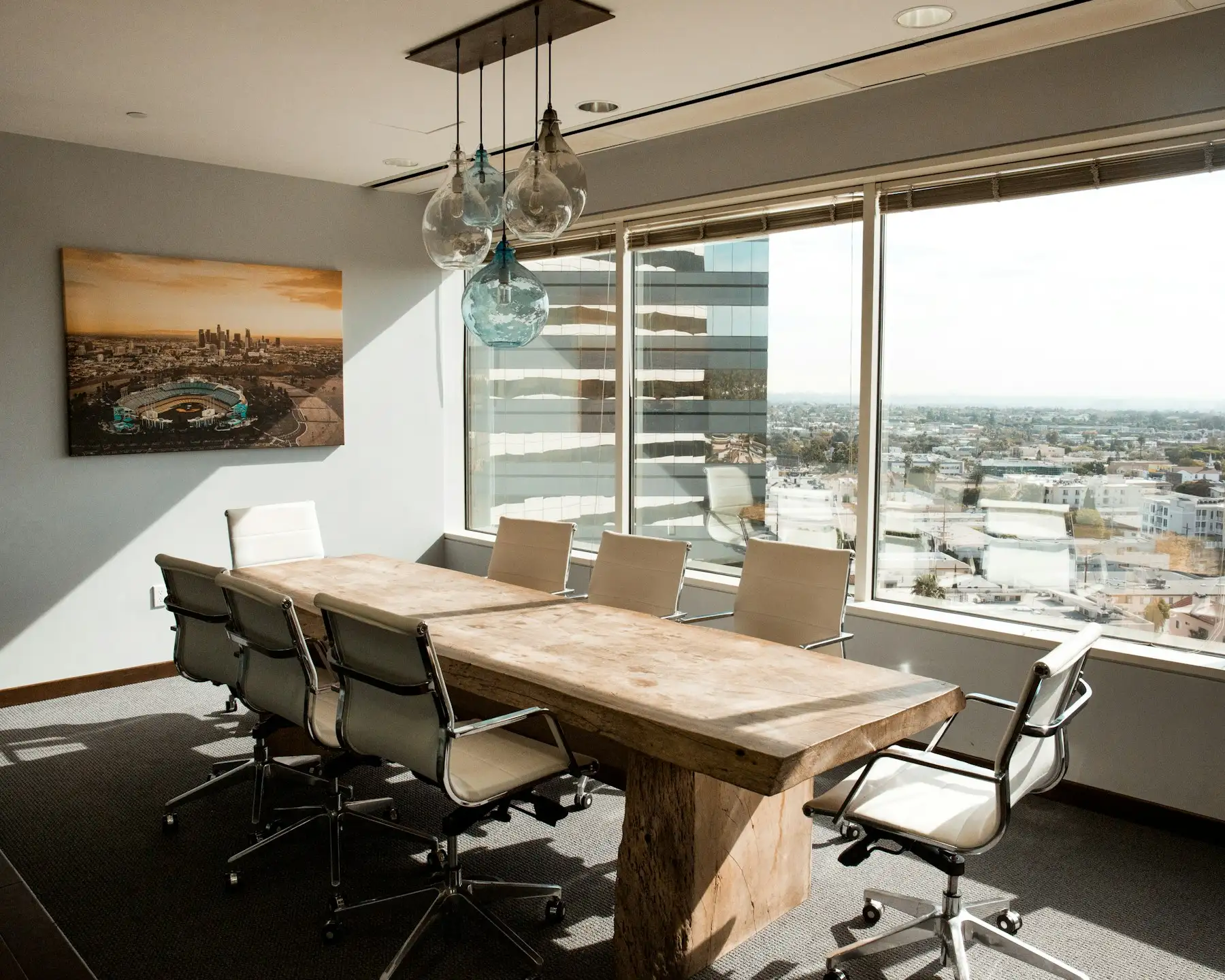 Boardroom table with a city view through the windows