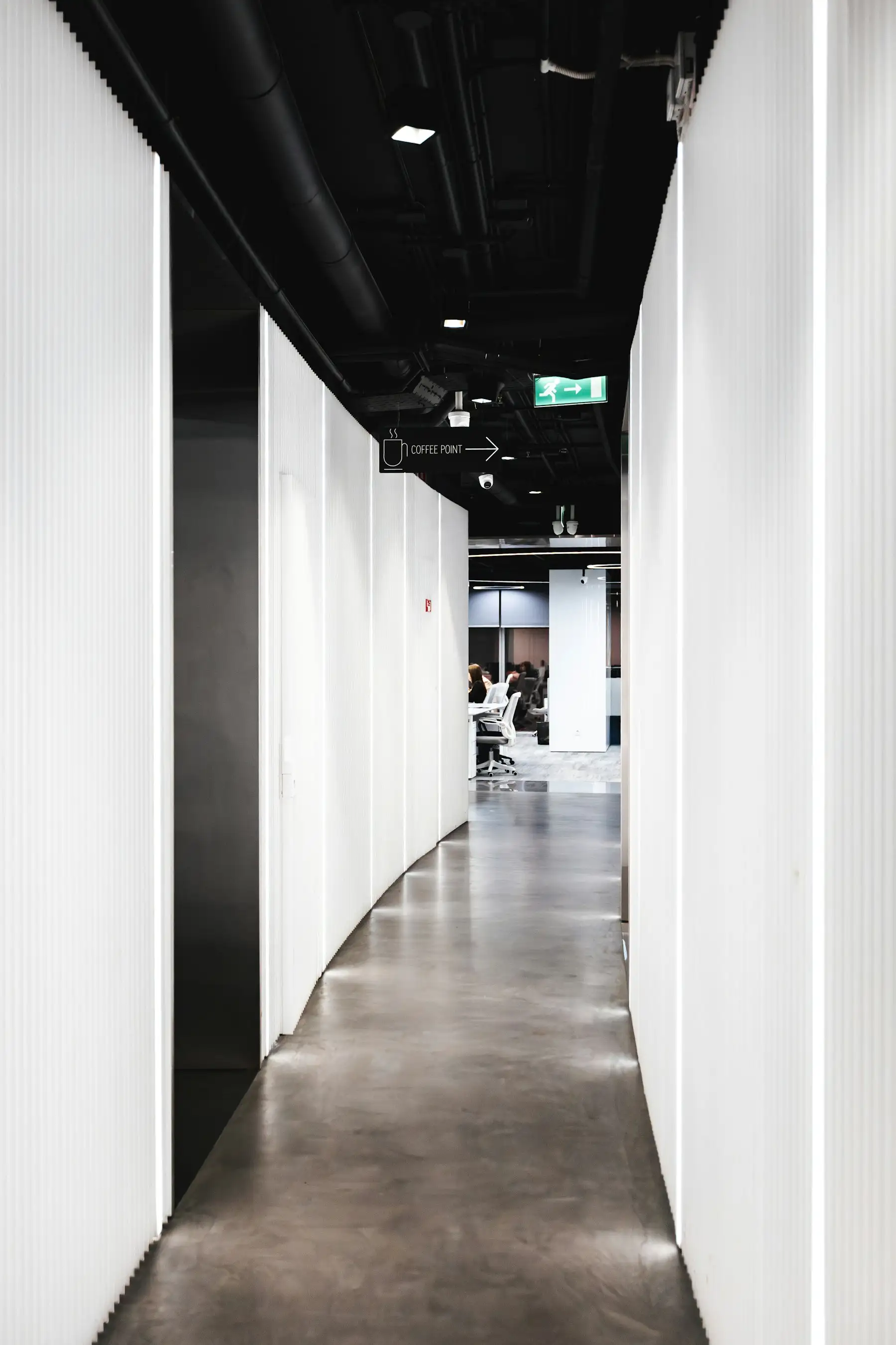 Minimalist corridor leading into a modern office