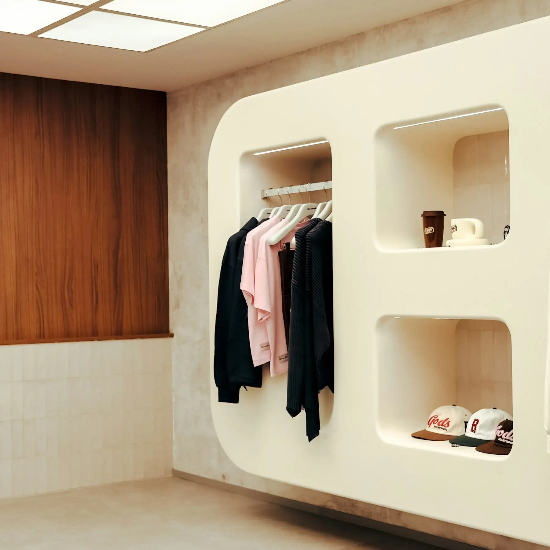 Minimalist retail display with clothing on hangers